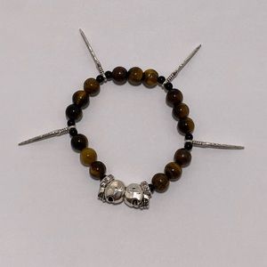 Tiger eye bracelet with metal feathers and skulls